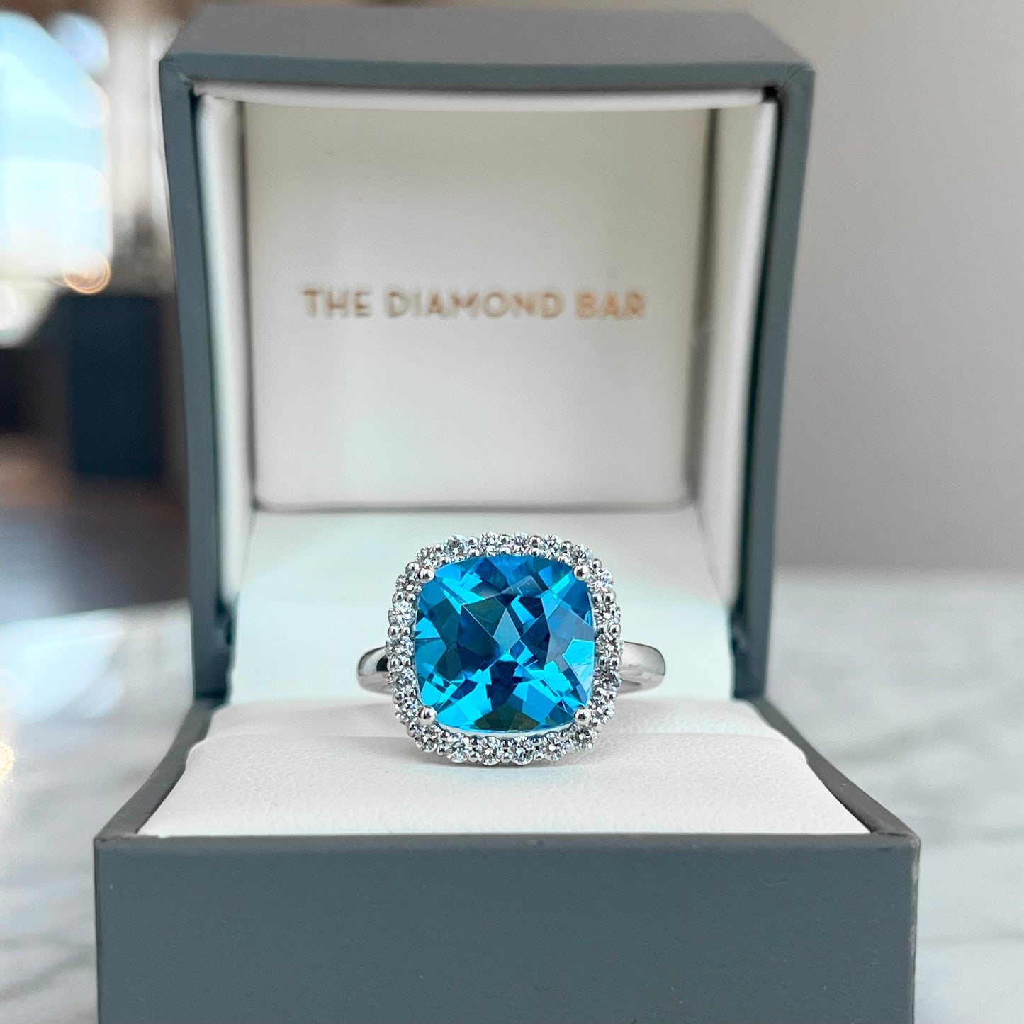 14K White Gold Blue Topaz Halo Ring