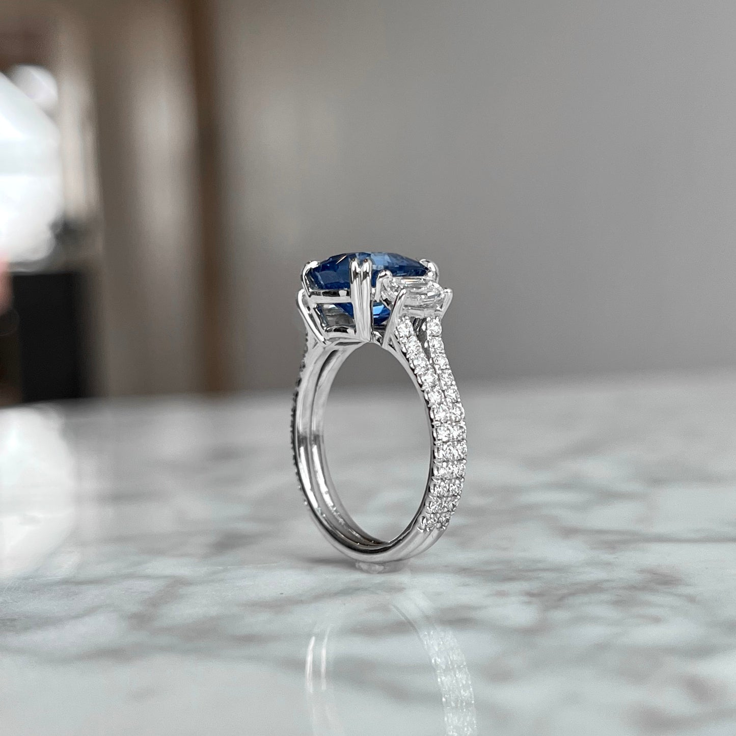 18K White gold Sapphire and Diamond Double Shank Three Stone Ring.