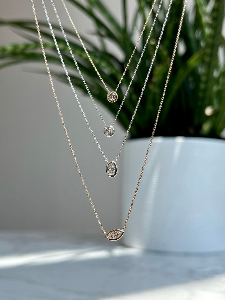 18K White Gold Oval Bezel Solitaire Necklace 18/100CT