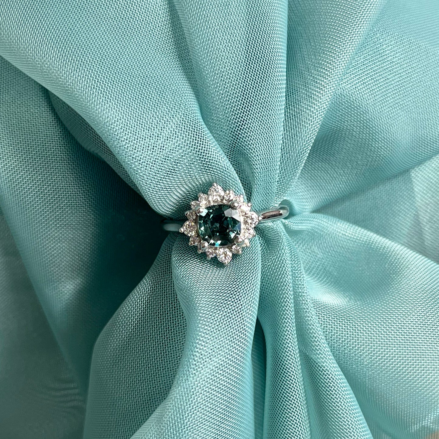 14K White Gold Color Shifting Teal Sapphire and Diamond Halo Ring