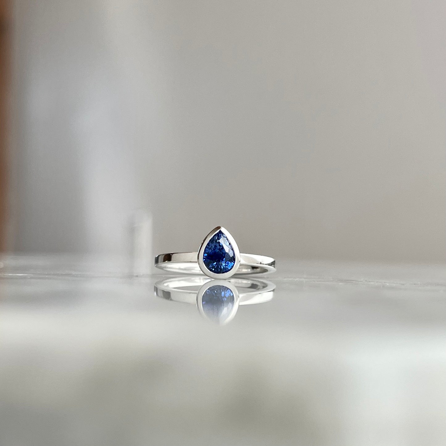 14K White Gold Pear Shape Blue Sapphrie Bezel Stackable Ring