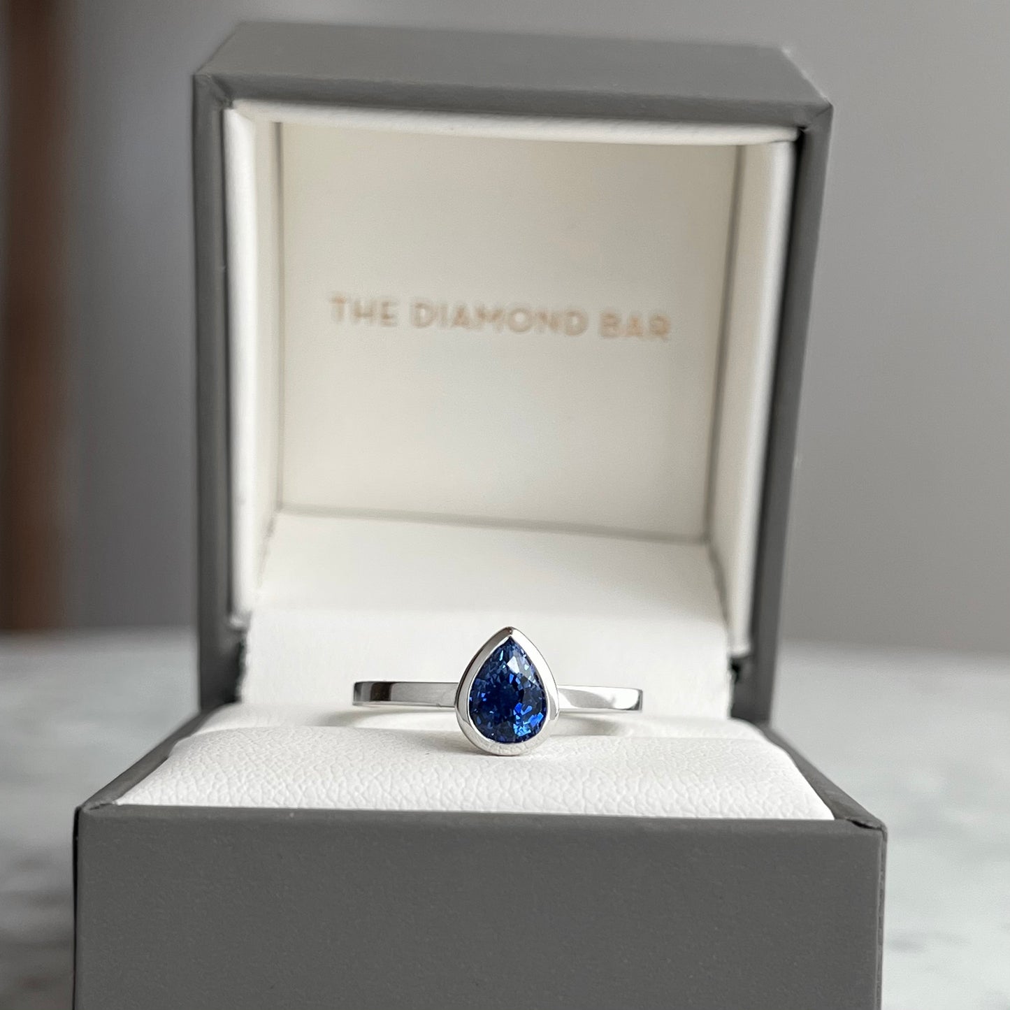 14K White Gold Pear Shape Blue Sapphrie Bezel Stackable Ring