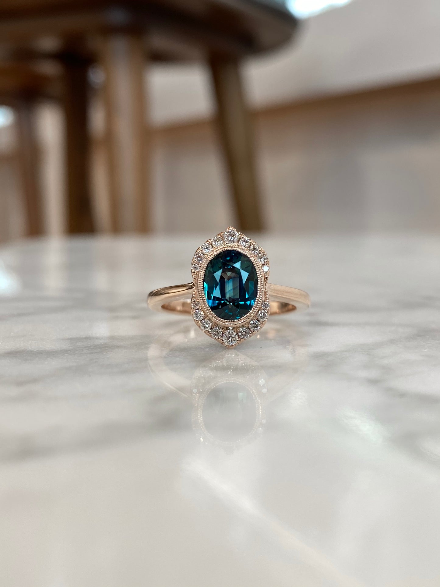 14K Rose Gold Oval Color-Shifting Teal Sapphire and Diamond Halo Ring