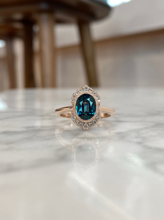 14K Rose Gold Oval Color-Shifting Teal Sapphire and Diamond Halo Ring