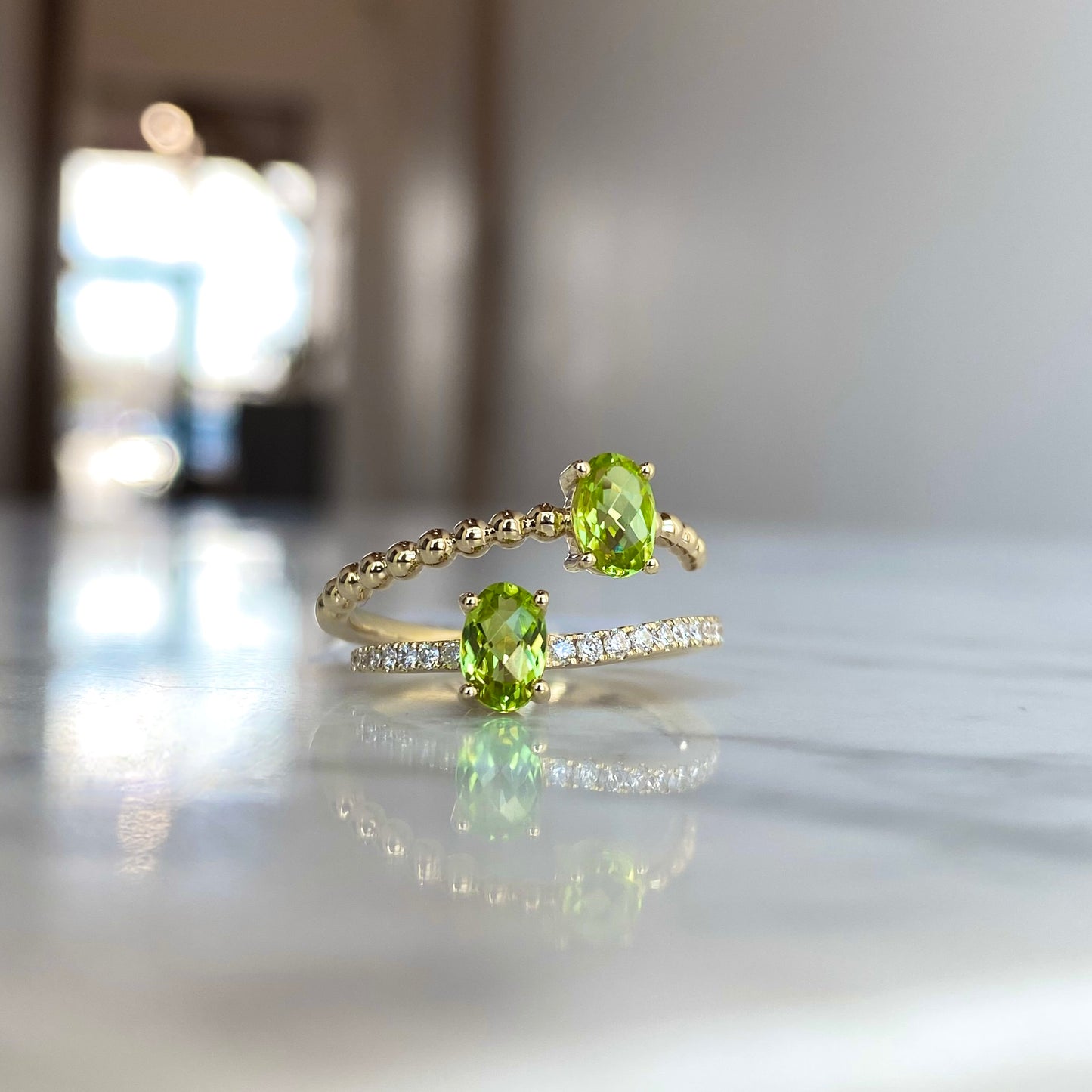 14K yellow gold oval cut peridot and diamond bypass ring