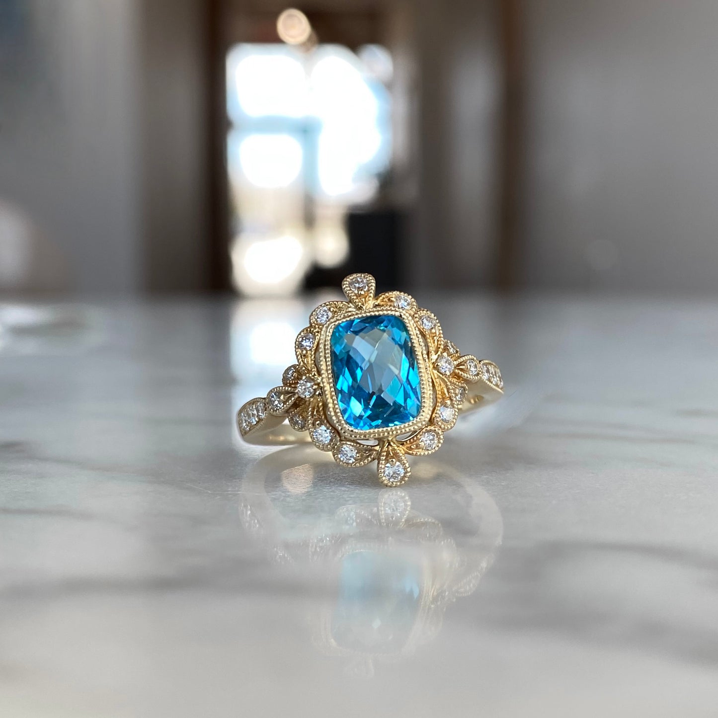 14K Yellow Gold Cushion Cut Blue Topaz and Diamond Millgrain Ring