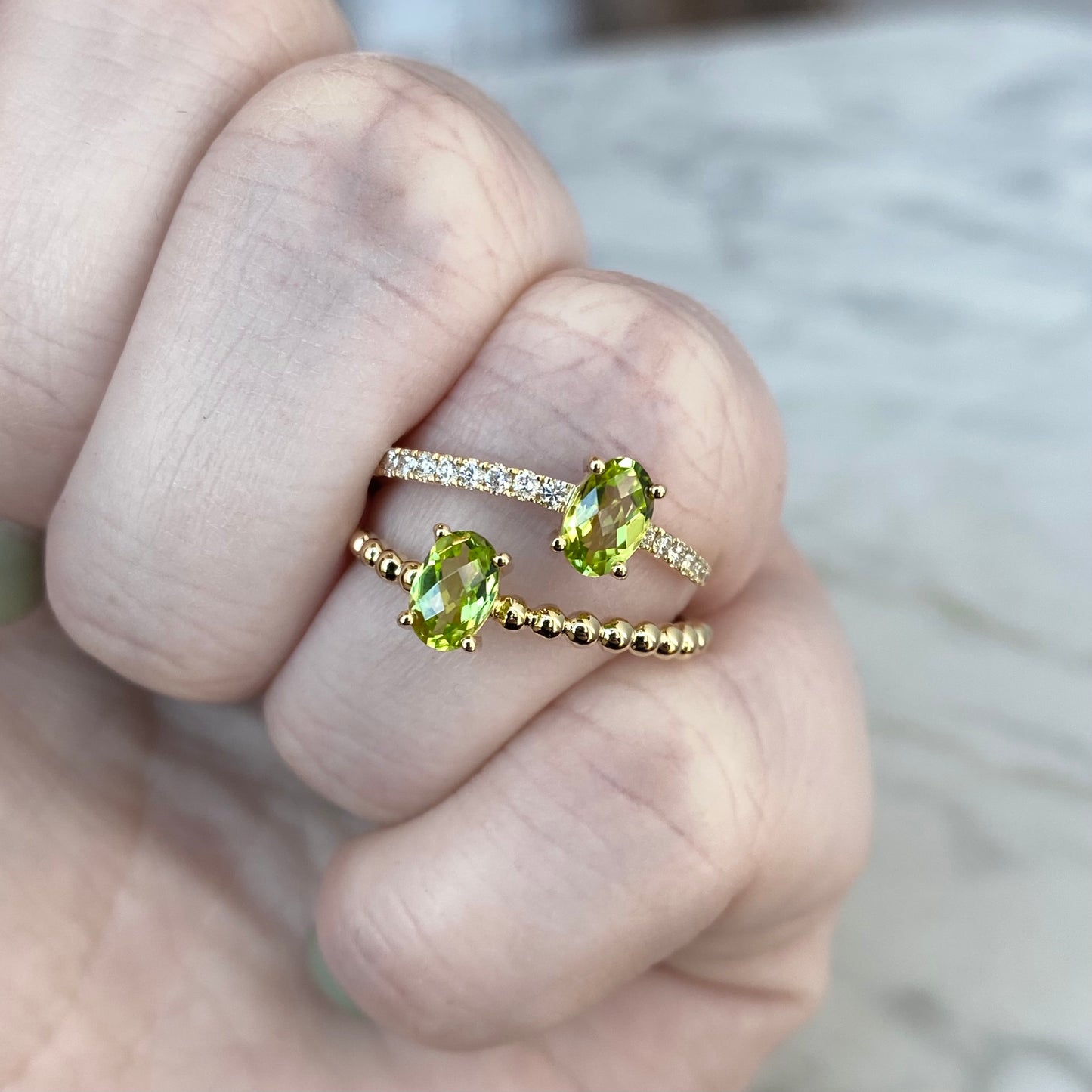 14K yellow gold oval cut peridot and diamond bypass ring