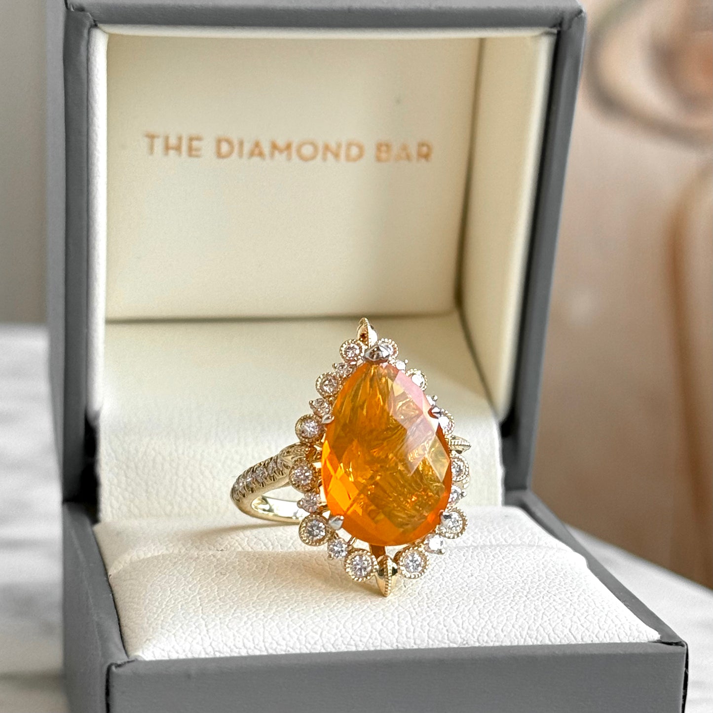 14K Yellow Gold Fire Opal and Diamond Halo Ring