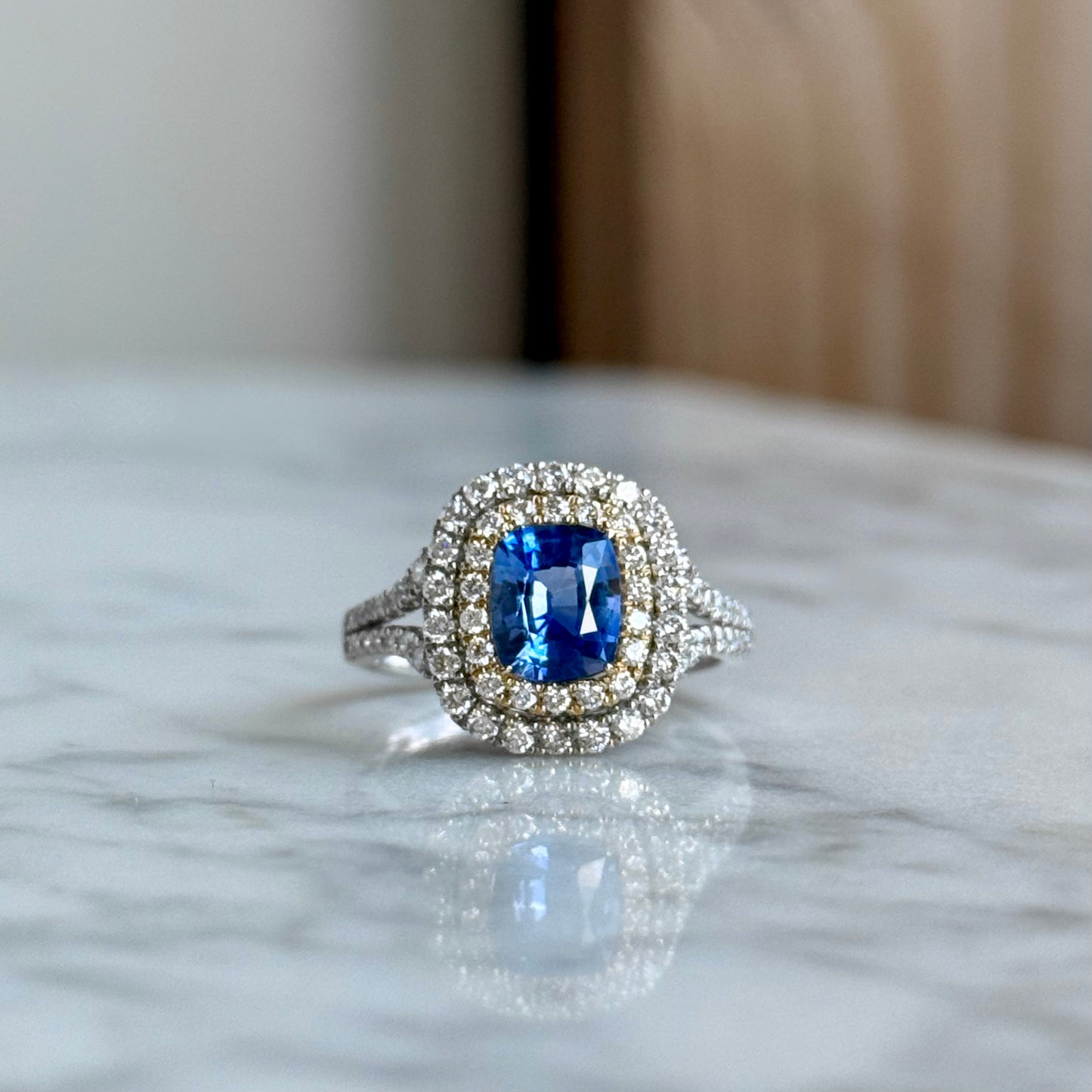 Platinum and 14K Yellow Gold Sapphire and Double Diamond Halo Ring