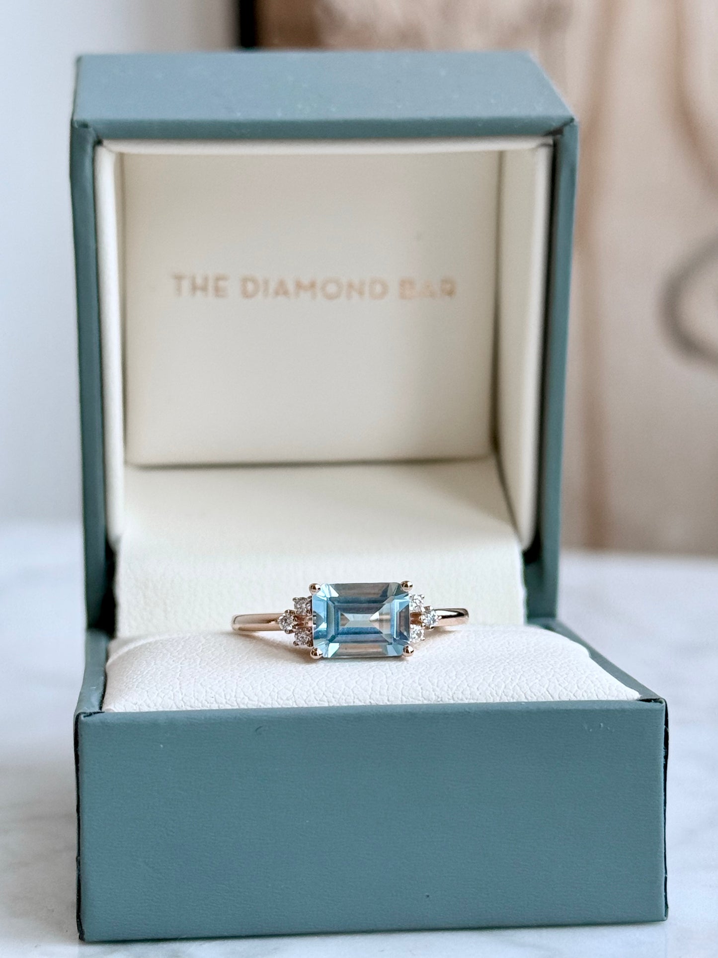14K Rose Gold Sky Blue Topaz and Diamond Ring