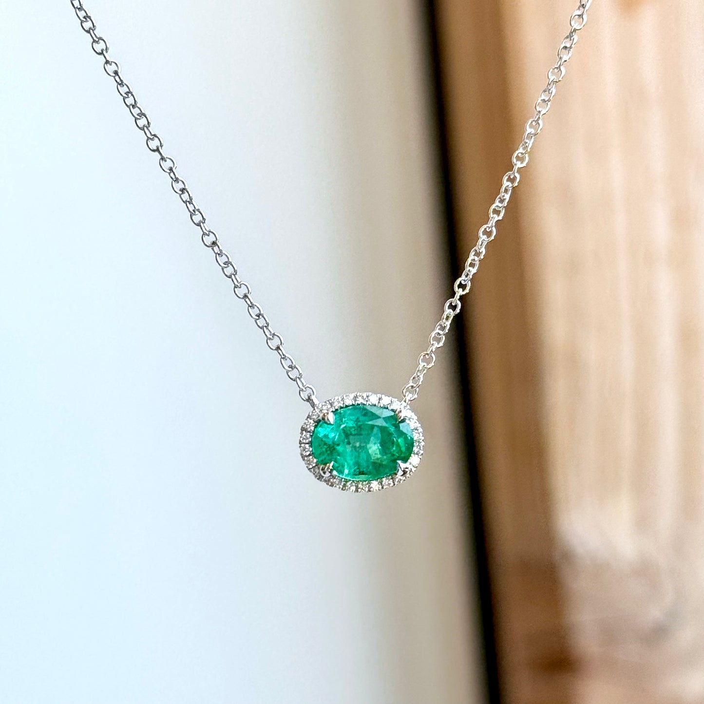 18K White Gold Emerald and Diamond Halo Necklace